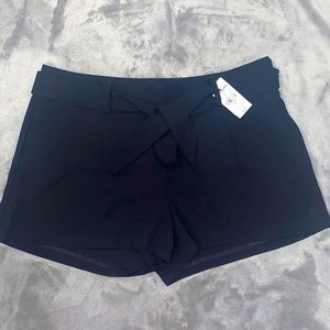 Black Express shorts with belt 100% Polyester. Size 0. New with Tag!!!